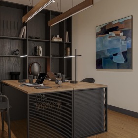 a room with a desk and shelves